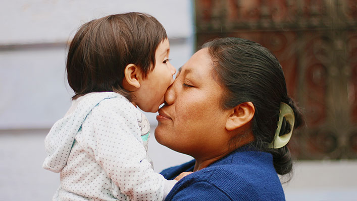 A mother holding her child