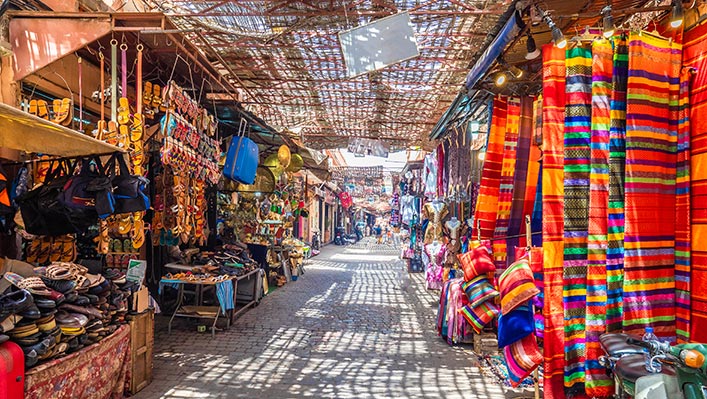 A colourful market with colourful clothing and items